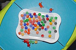 Plastic colored mosaic game on the table