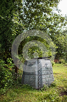 Plastic composter in a garden