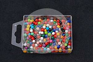 Box of colored map-pins