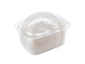 Plastic container with sour cream isolated