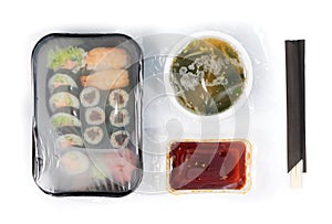 Plastic container with sushi set ready for takeout delivery