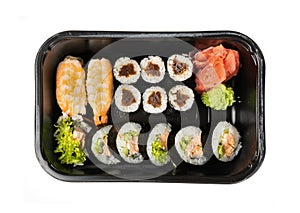 Plastic container with sushi set ready for takeout delivery