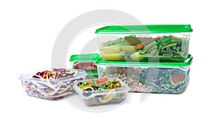 Plastic containers with fresh food on white background