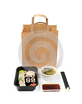 Plastic containers with sushi set ready for takeout delivery