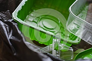 Plastic containers in a trash bag