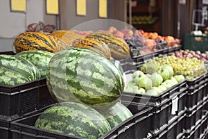 Plastic crates with delicious fruits