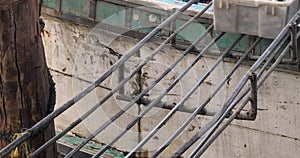 plastic crates filled with fish sliding along a metal track on a fishing boat