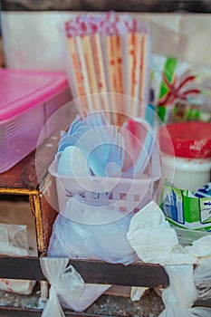 Plastic cutlery and bamboo sticks in Asia