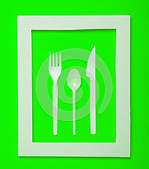 Plastic cutlery for picnics in a white frame