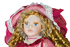 Plastic doll portrait closeup - blue eyes and curly blonde hair - beautiful doll