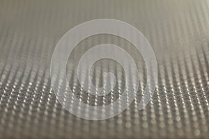 Abstract background of lots of grey pimples dots. Plastic surface with pimples