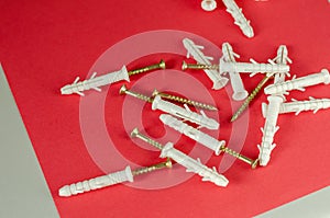 Plastic dowels with impact screws