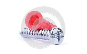 Plastic dowels and metal screws isolated on a white background.Wall plugs