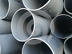 Plastic drain pipes pvc in a pile