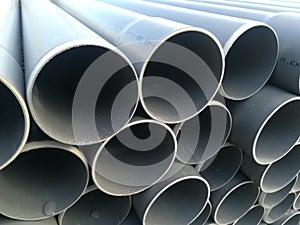 Plastic drain pipes pvc in a pile