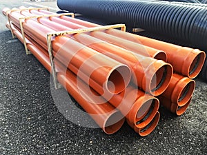 Plastic drain pipes pvc in a pile