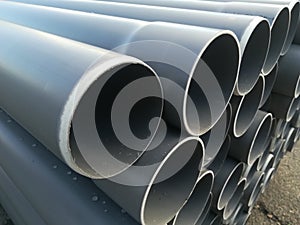 Plastic drain pipes pvc in a pile