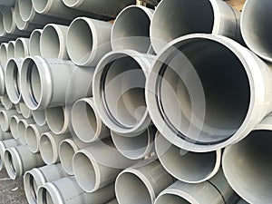 Plastic drain pipes pvc in a pile