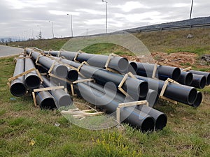 Plastic drainage pipes  pile connecting each other by the road