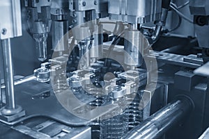 The plastic drinking bottles in the  blowing mold machine.