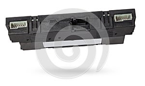 Plastic electronic control unit with black and blue connectors on a white isolated background in a photo studio. Spare part for