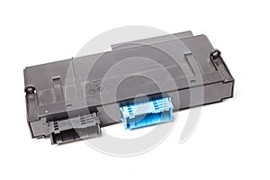 Plastic electronic control unit with black and blue connectors on a white isolated background in a photo studio. Spare part for