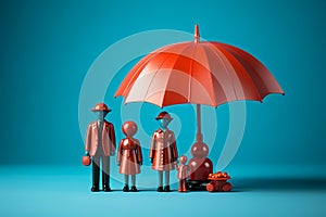 Plastic figures in the form of a family protected by a red umbrella. Insurance concept