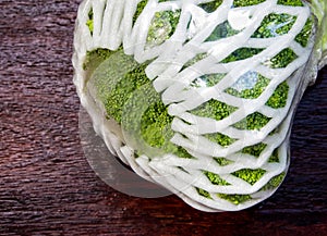 Plastic film wrap protect for Broccoli vegetable by plastic wrap