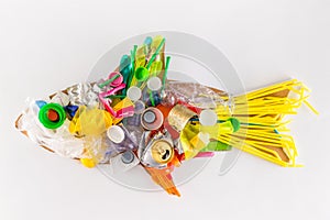 A plastic fish made of disposable and waste plastics, ecology concept