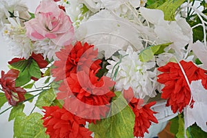 plastic flowers or red and white flowers for decoration
