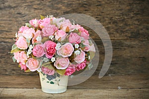 Plastic flowers with wooden background in vintage picture style, home interior equipment, Flowers set on wooden background