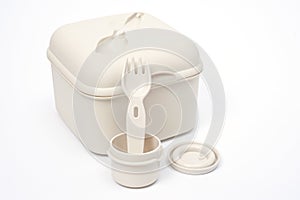 Plastic food container with built-in fork and gravy boat