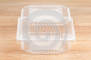 Plastic food package on wooden background