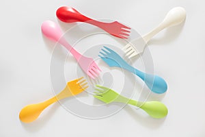 Plastic forks and spoons on White Background