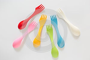 Plastic forks and spoons on White Background