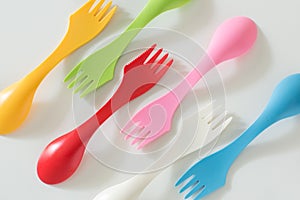 Plastic forks and spoons on White Background