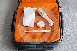 Plastic free travel, traveling sustainably. How to use less plastic on holiday. Eco Friendly Travel Products in orange