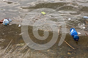 Plastic garbage floating in river. Environment pollution problem