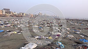 Plastic garbage and other pollution on beach in Mumbai, India