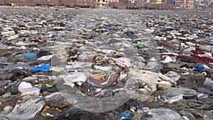 Plastic garbage and other pollution on beach in Mumbai, India