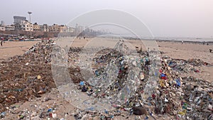 Plastic garbage and other pollution on beach in Mumbai, India