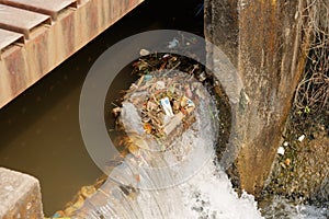 Plastic garbage in the river , pollution and environment in water