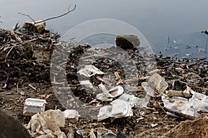 Plastic garbage in the river , pollution and environment in water