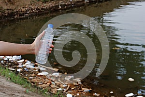 Plastic garbage in the river , pollution and environment in the water