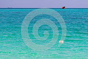 Plastic garbage in the sea at Ko Lipe island, Thailand. Plastic pollution is big problem for sea and ocean organisms. Concept of