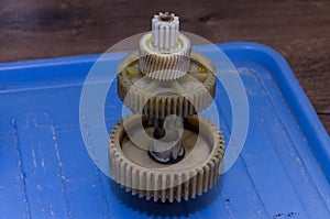 Plastic gears of a disassembled gearbox in a repair shop
