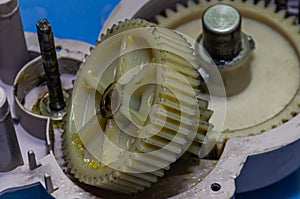 Plastic gears of a disassembled gearbox in a repair shop