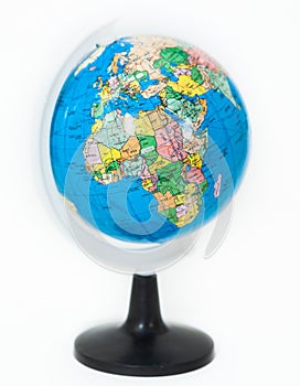 Plastic globe with Africa continent on foreground, white background