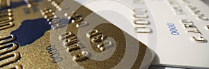 Plastic gold and platinum credit card, close-up