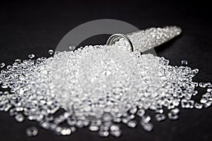 Plastic in granules on a black background.